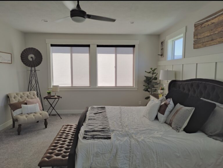 White light fitlering rollershades with black top treatment in bedroom