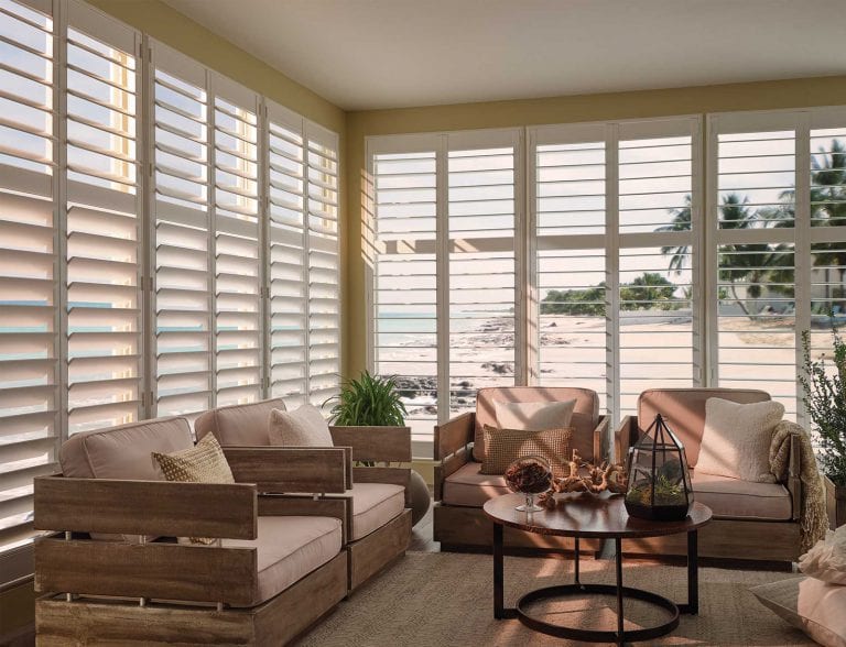 Large windows covered with custom shutters.