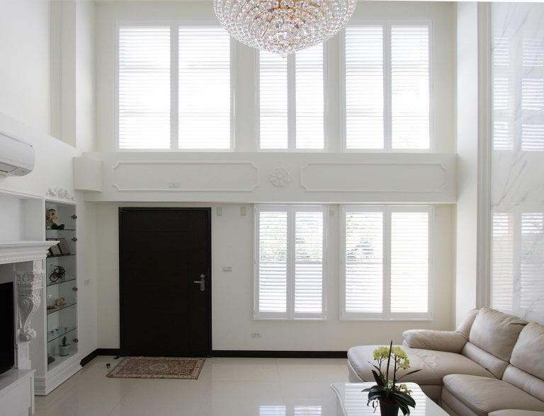 Large room with white shutters.
