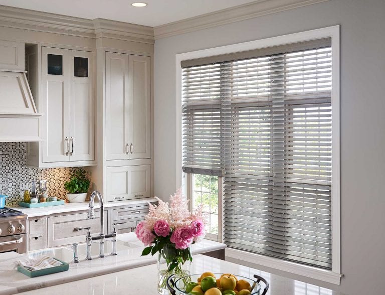 Grey blinds in a kitchen.