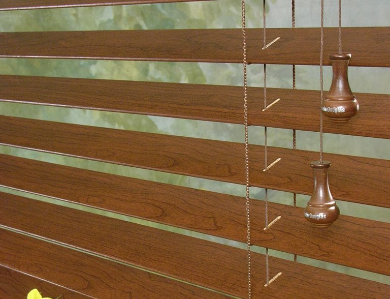 Close up view or stained wood blinds.