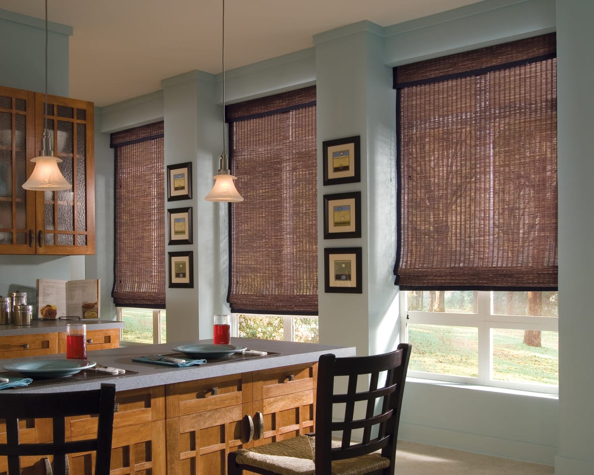 Woven wood shades on large kitchen windows.