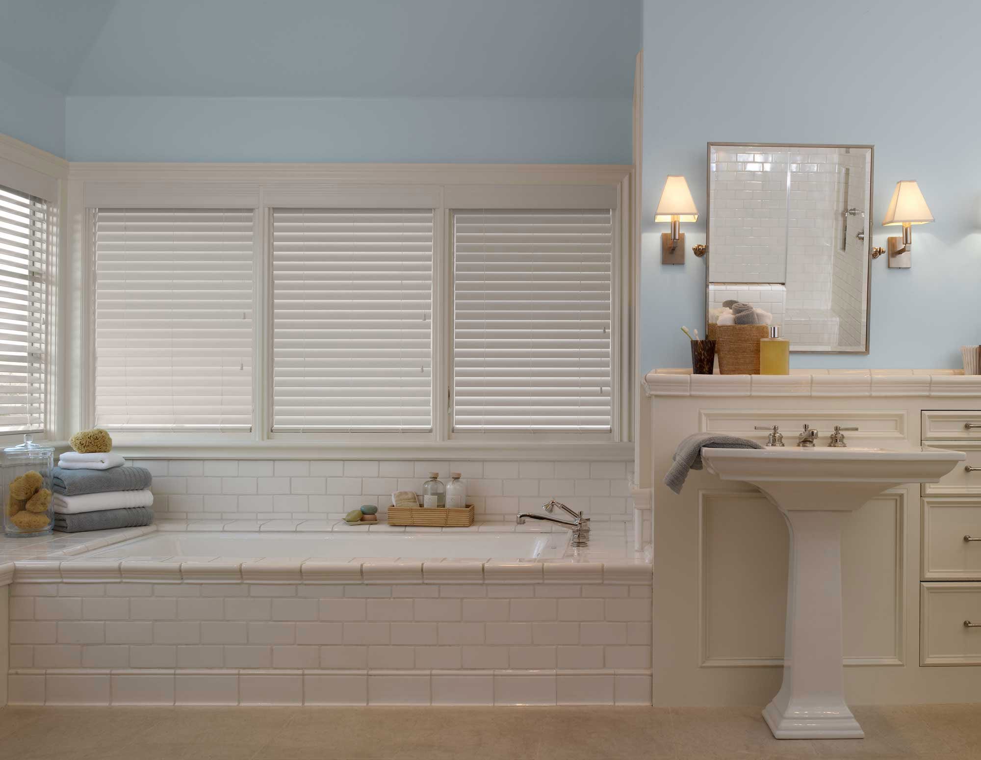 White blinds in a bathroom.