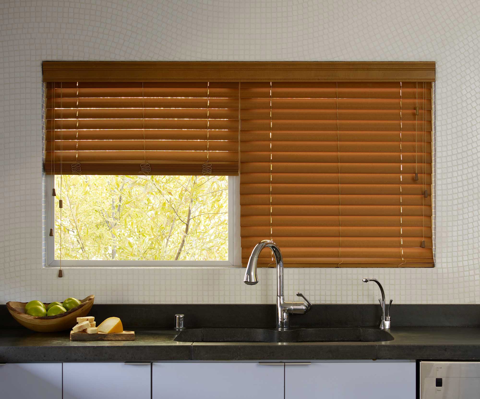 two blinds installed on one kitchen window.