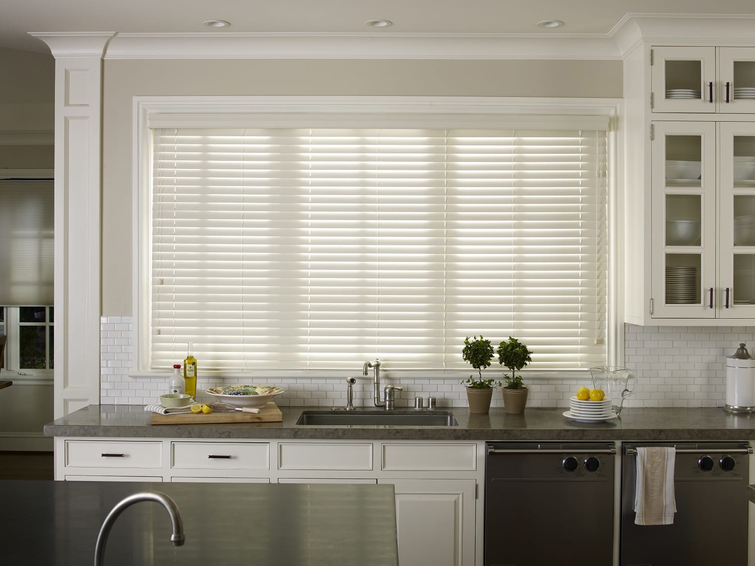 White faux blinds in a kitchen.