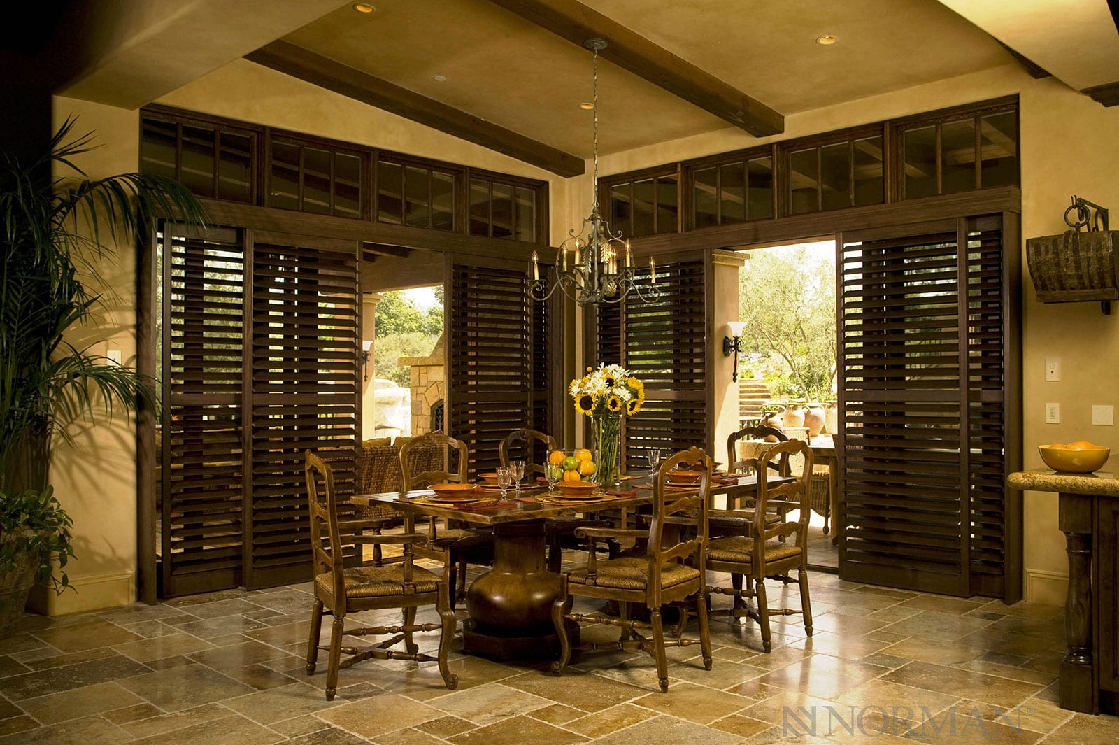 Large dining room with stained bypass shutters.