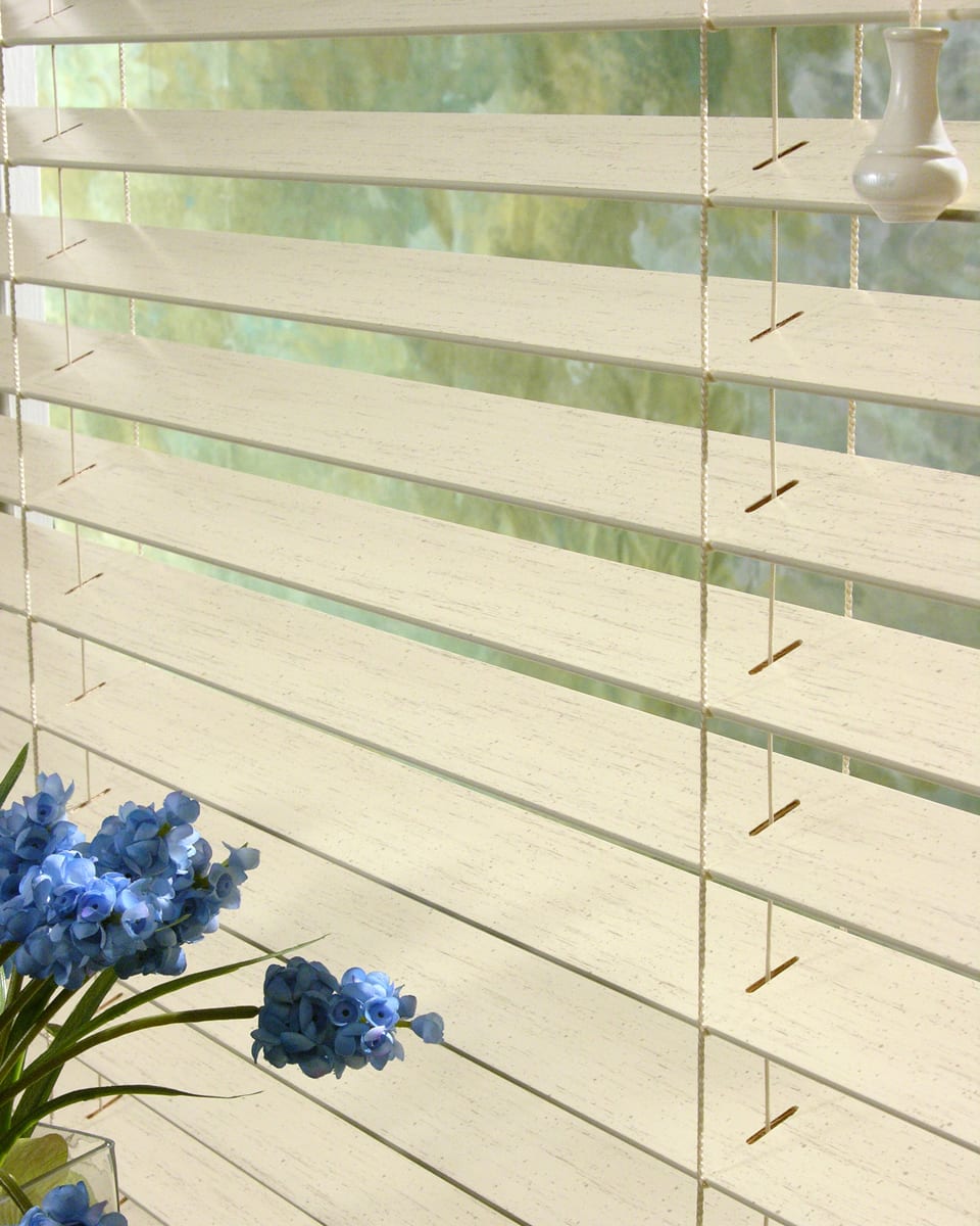 Wood colored faux wood blinds.