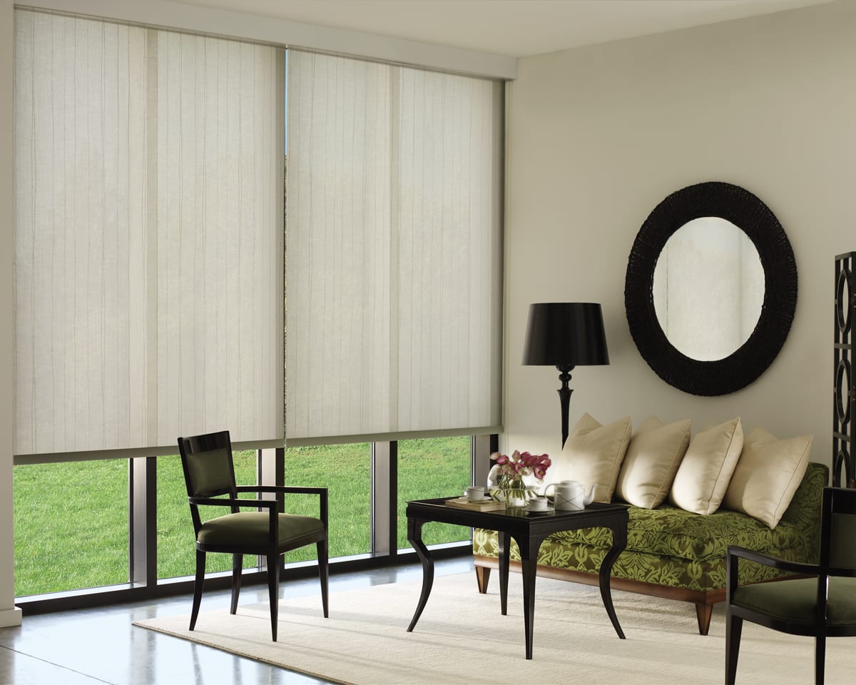 Light filtering roller shades with a fascia top treatment.