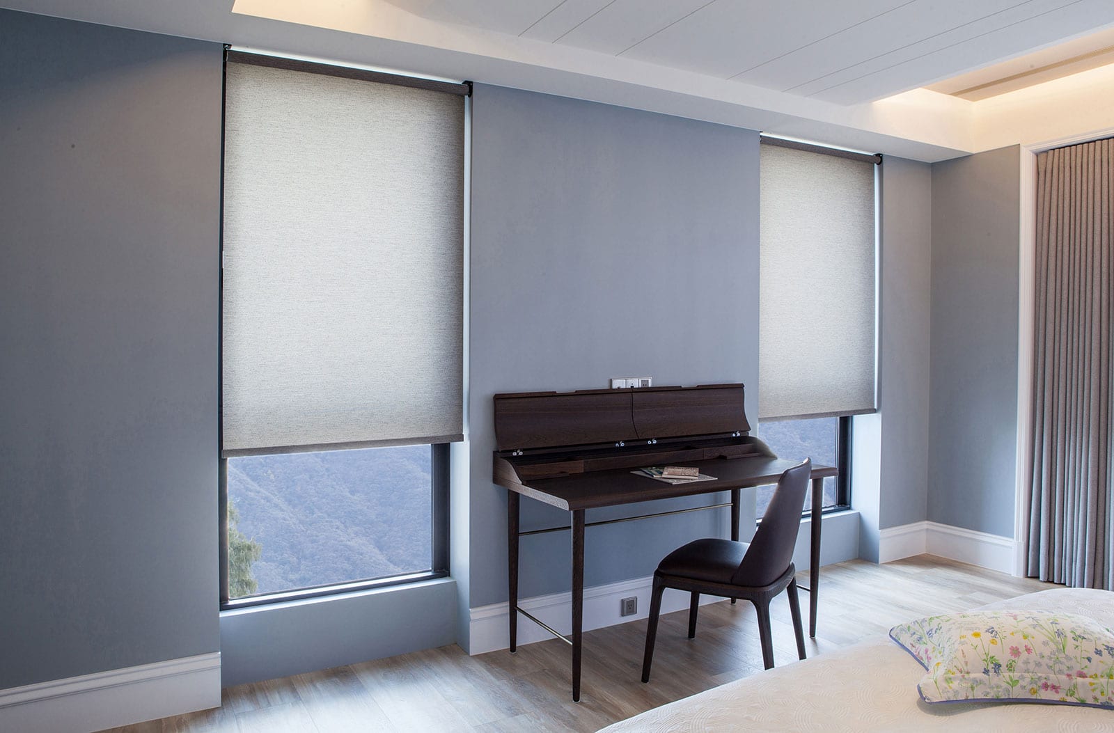 Light filtering roller shades with bottom of the window open.