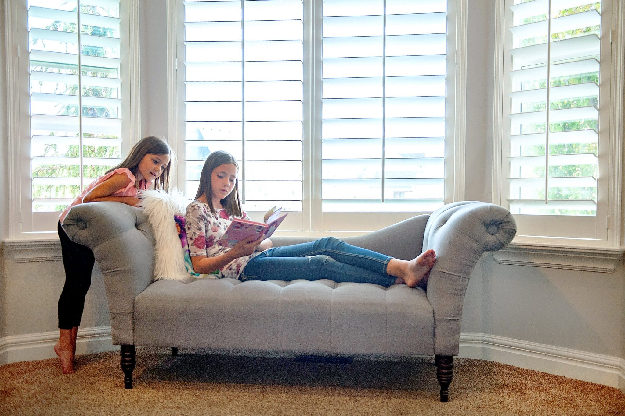 composite shutters in a family home bay window