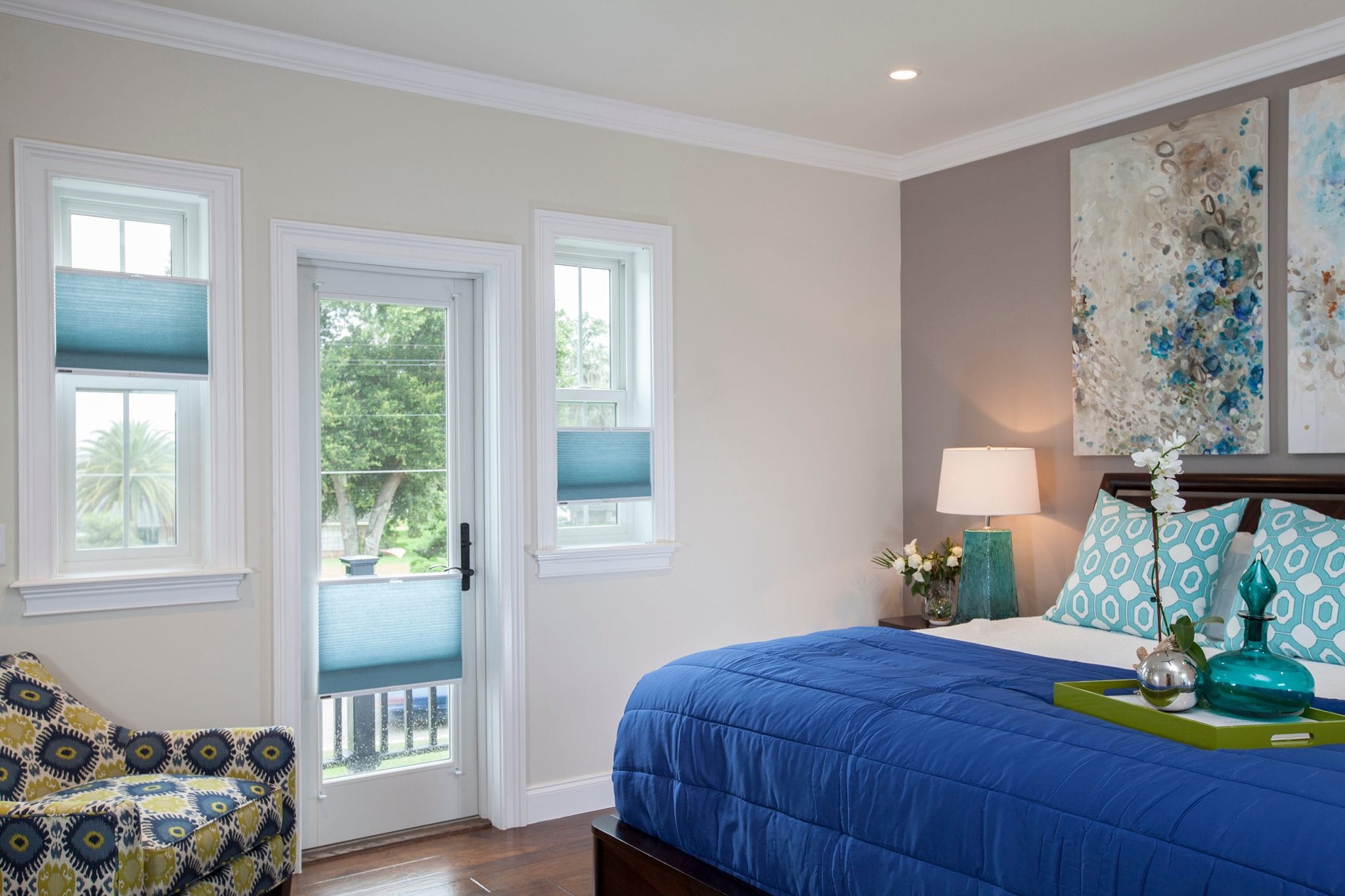 Top down bottom up honeycomb shades in a bedroom.