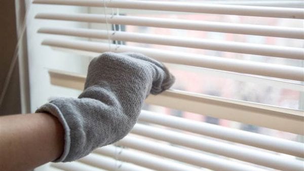 Wipe away dust from blinds